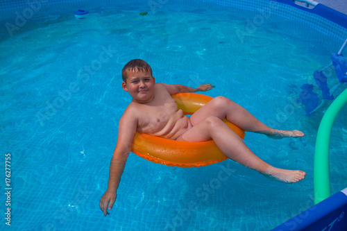 Child eight years old inside swimming pool