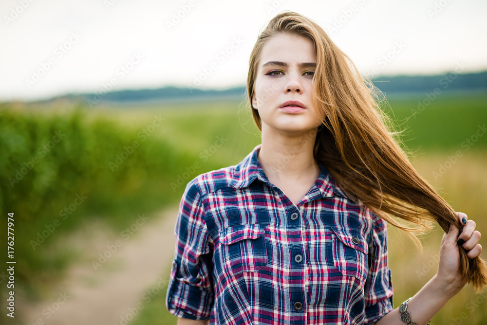 Portrait of a beautiful girl in a field Portrait of a beautiful girl in a field