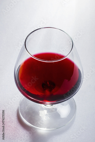 Glass of wine on white