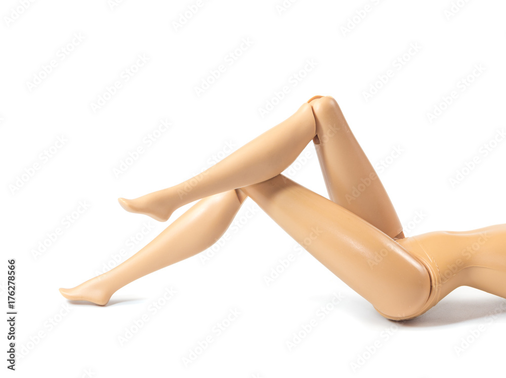 The beautiful slender legs of pretty figure girl doll doing gestures sexy isolated on white background