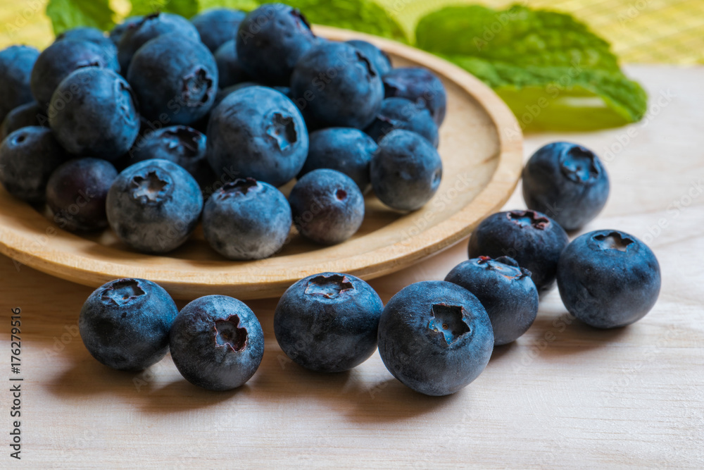Arrangement blueberries on plank Arrangement blueberries on plank