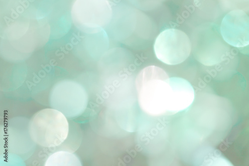 Shiny green New Year background for holiday card. Balls of different colors and sizes.