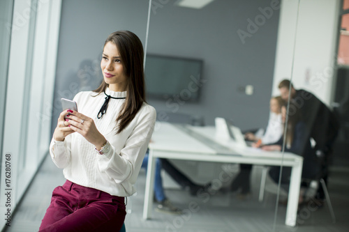 Modern business woman using...