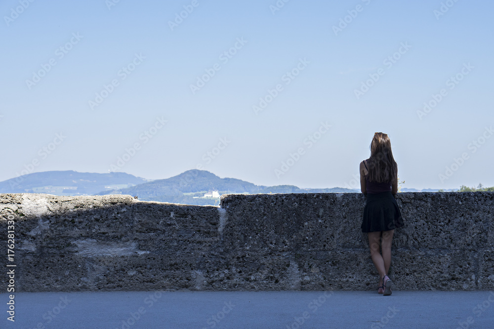 A woman looking at the mountains