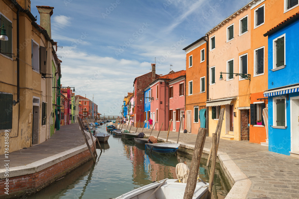 Colourful buildings lining cannal, Island of Burano, Venice Italy