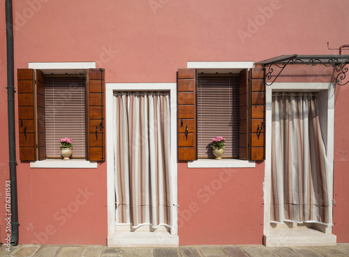 Burano, Venice / The small yard with bright walls of houses photo