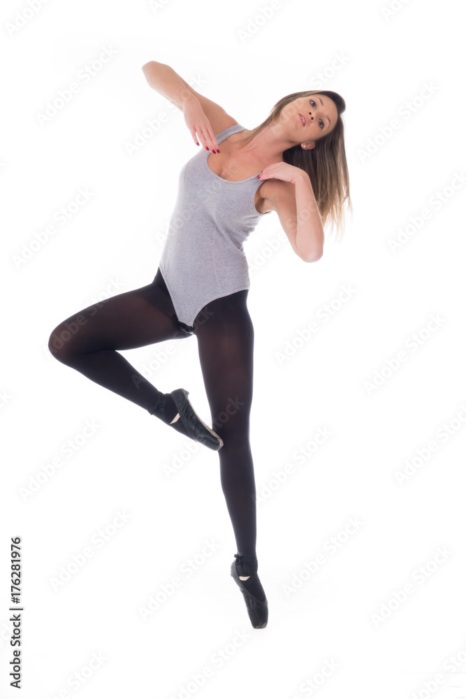 young beautiful woman dancer with long black hair wearing gray vest and tights jumping on a light white studio background young beautiful woman dancer with long black hair wearing gray vest and tights jumping on a light white studio background