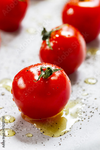 Cherry tomatoes poured with olive oil