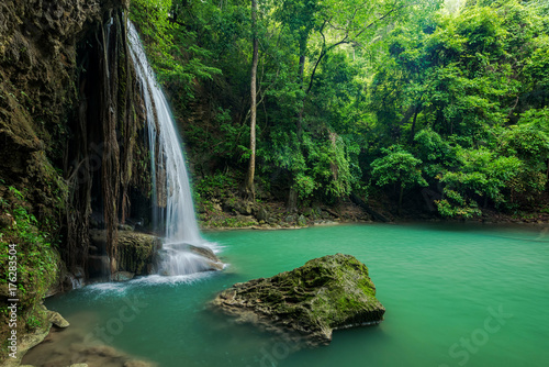 Breathtaking green waterfall at deep forest  Erawan waterfall located Kanchanaburi Province  Thailand