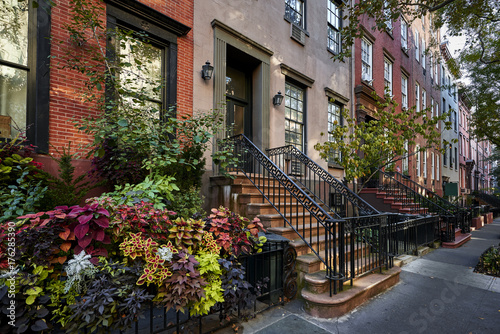 a row of colorful brownstone buildings photo