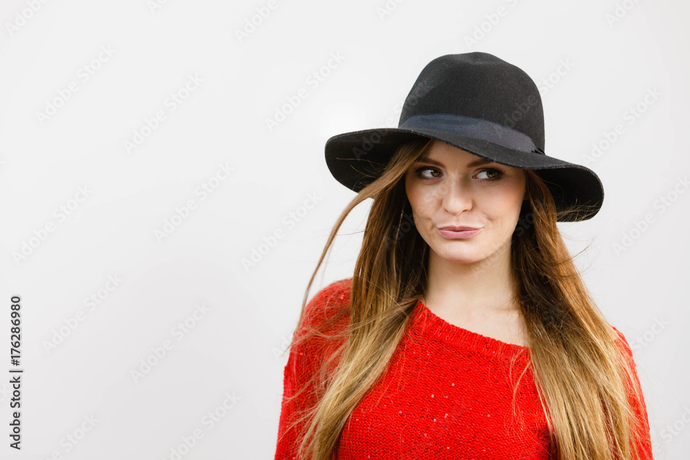 Smiling pretty girl with brown hair and black hat. Smiling pretty girl with brown hair and black hat.