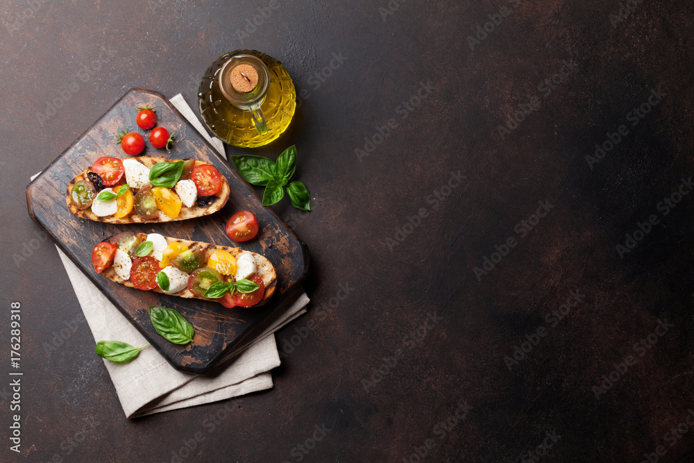 Bruschetta with tomatoes, mozzarella and basil Bruschetta with tomatoes, mozzarella and basil