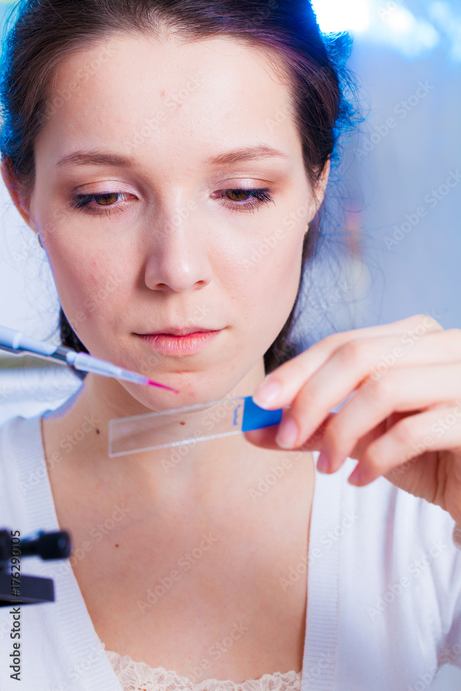 A girl technician in a medical laboratory A girl technician in a medical laboratory
