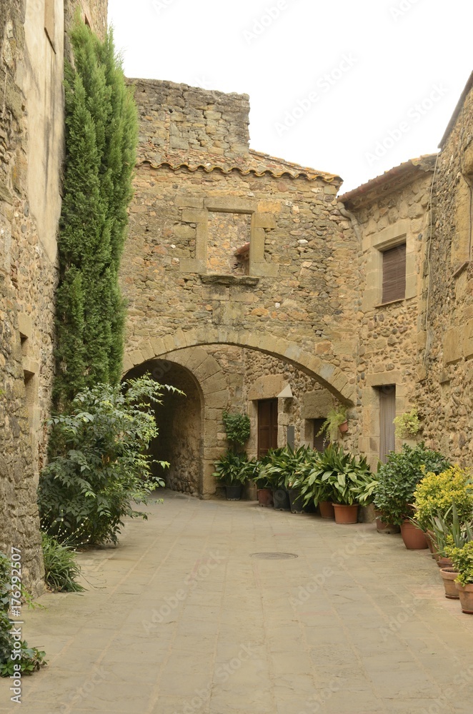 Stone arches at passageway in Monells, Girona, Spain