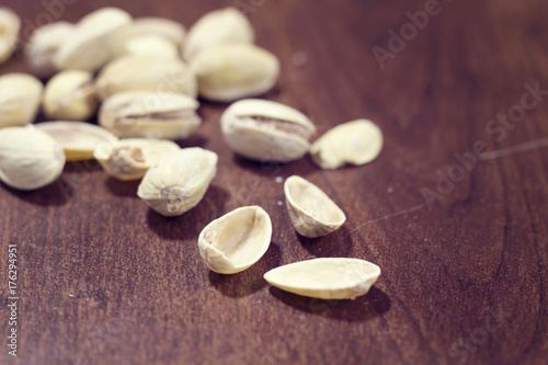 many of salted fruit dry pistachio on wood background