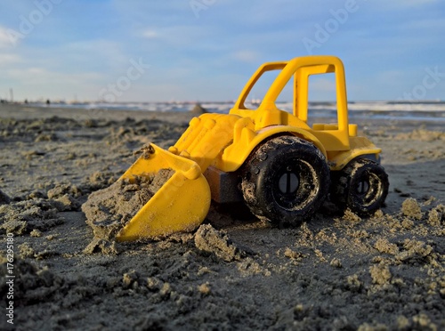 Toy loader working in the sand
