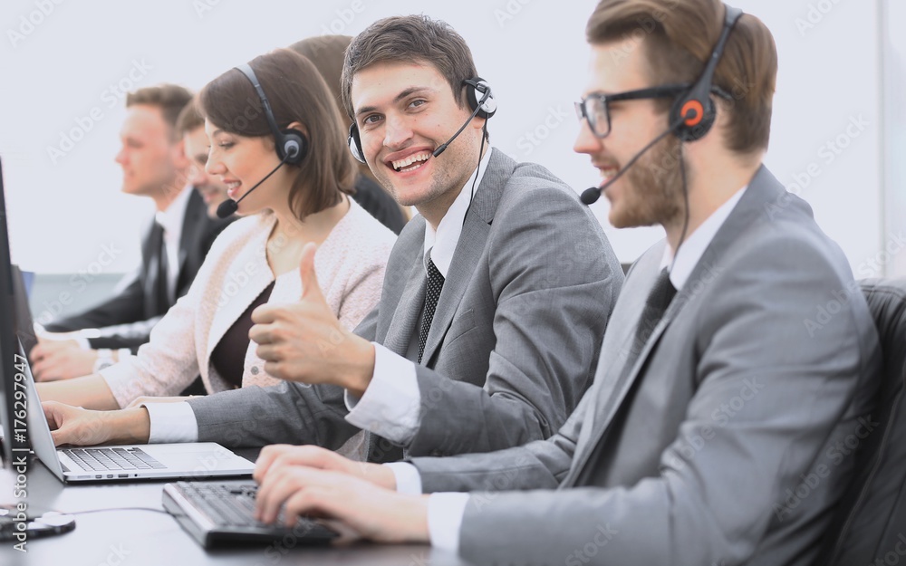 employee call center with headset showing thumb up employee call center with headset showing thumb up