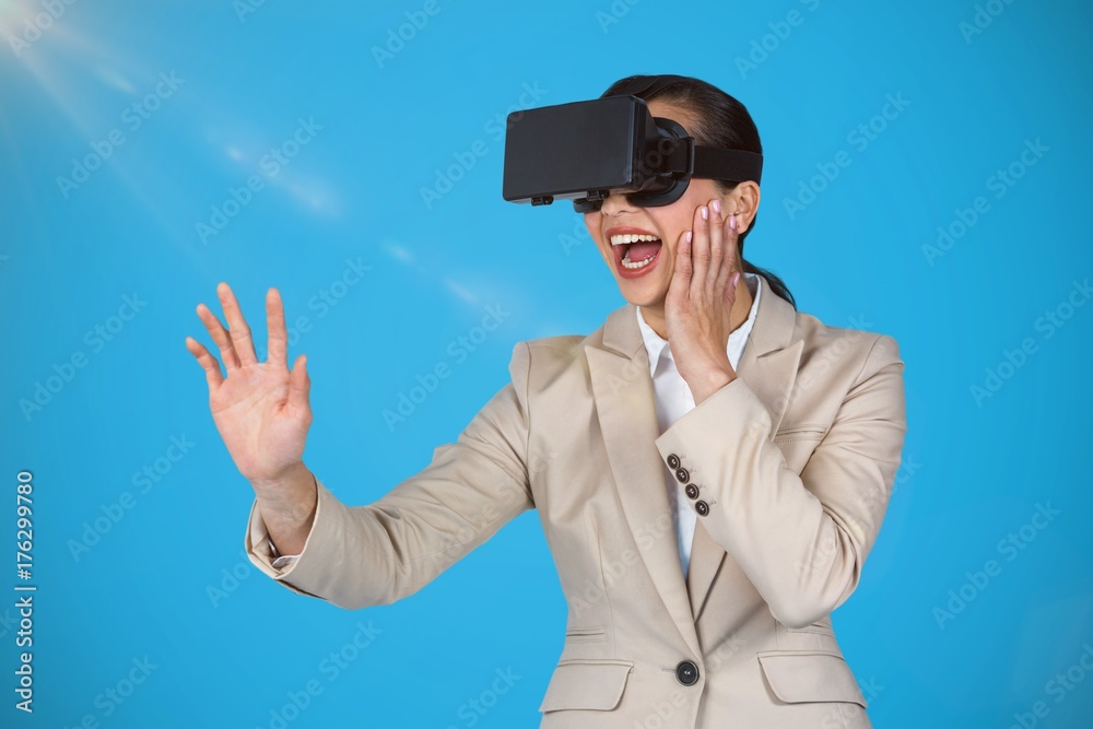 Composite image of excited businesswoman wearing virtual video Composite image of excited businesswoman wearing virtual video