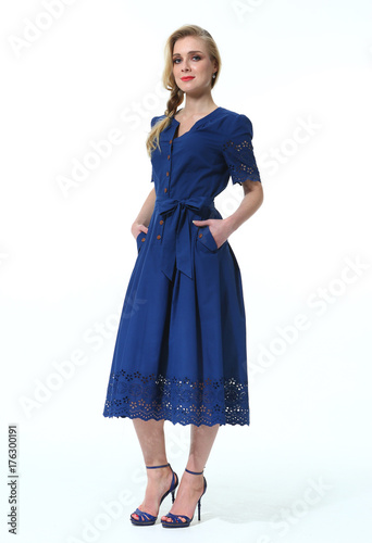 blond business woman in casual summer long blue dress stiletto heels full body portrait isolated on white photo