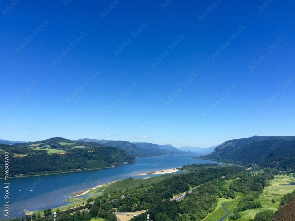 Oregon Landscape with its gorgeous rivers and mountains. Mother nature and its wonders. Nature background with sky, river and land. Simple earth backgrounds for presentations. 