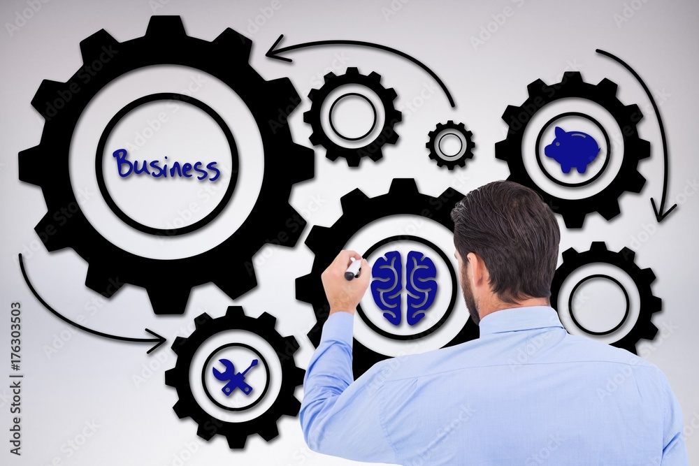 Composite image of businessman in suit writing with marker Composite image of businessman in suit writing with marker
