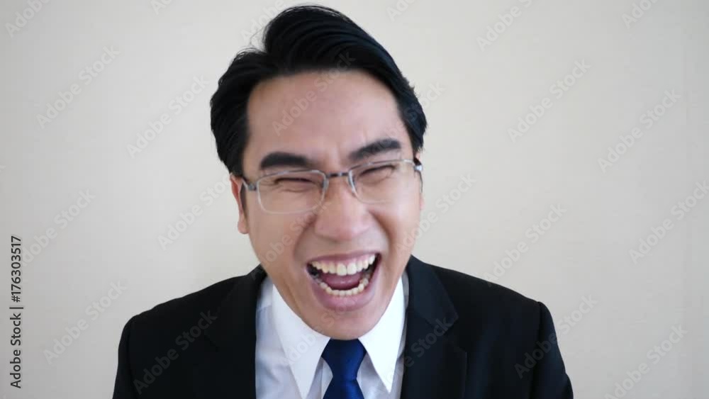 Businessman laughing.