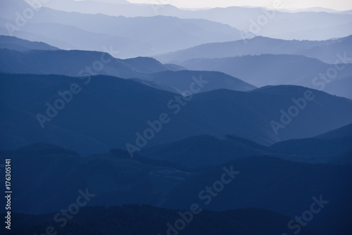 Fototapeta Naklejka Na Ścianę i Meble -  Carpathian mountains summer sunset landscape with abstract gradient of mountain peaks in blue colors, natural travel outdoor background