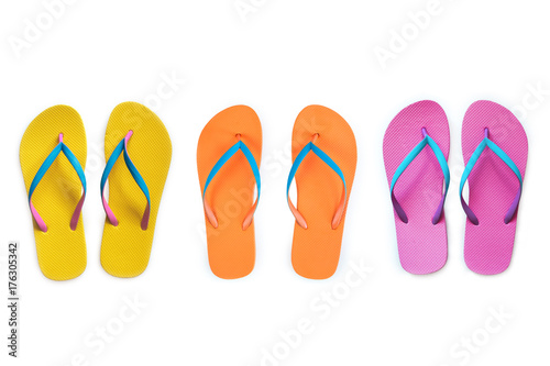 Yellow Orange Pink flip flops isolated on white background. Top view