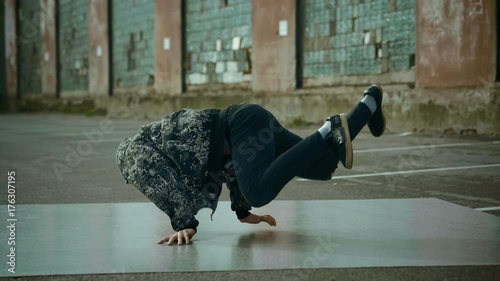 Hip-hop and breakdancing. Breakdancer dancing in the street. Slow motion. HD