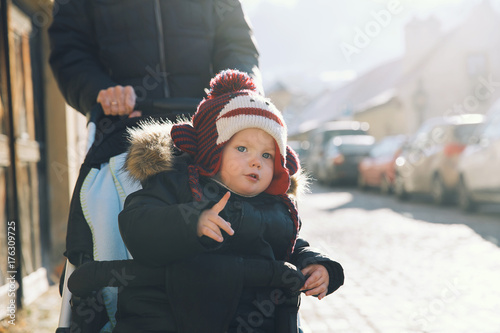 Child boy spending winter holidays with family in Cesky Krumlov photo