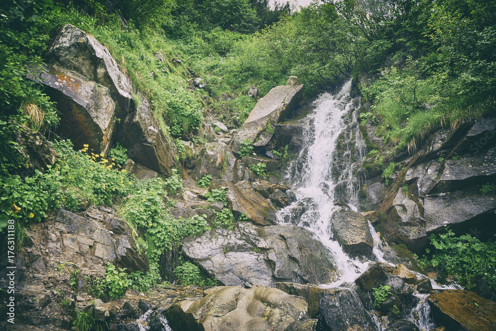 Obraz premium mountain river with waterfall