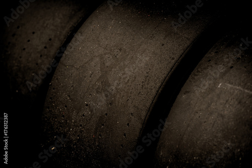Black racing motorsport tires row closeup