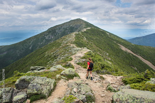 Teenage girl hiking on a beautiful mountain 
