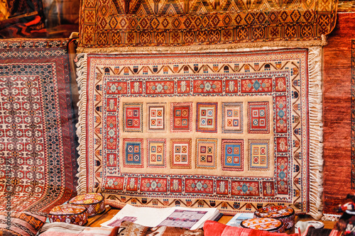 Turkish carpet in the storefront is on sale in the bazaar market