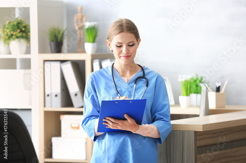 Young female receptionist h...