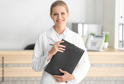 Young female receptionist h...