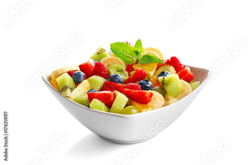 Bowl with yummy fruit salad, isolated on white