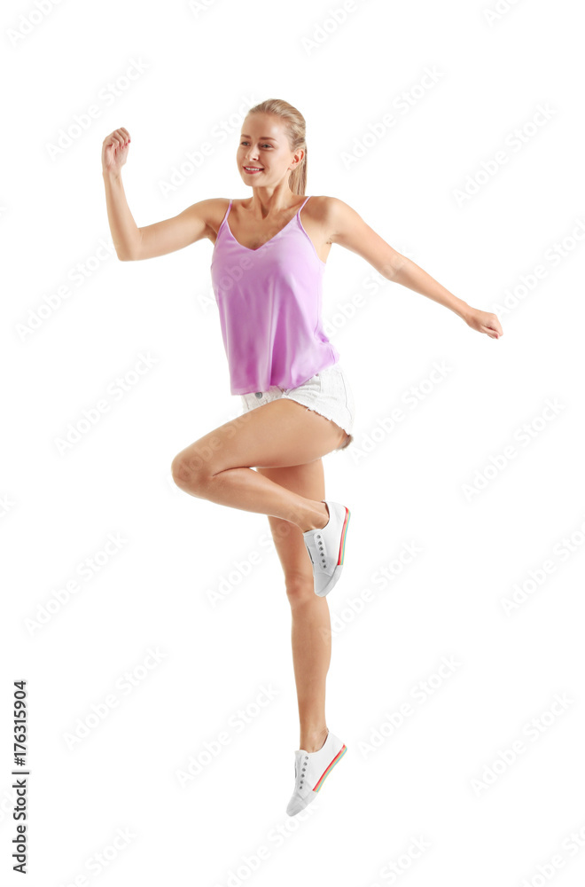 Young beautiful woman running against white background