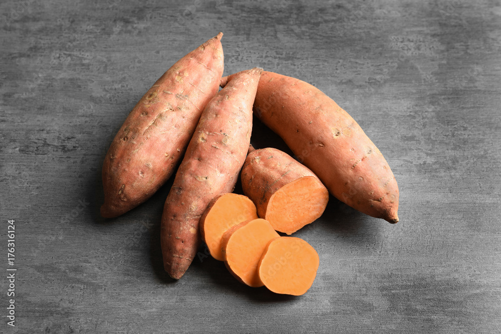 Sweet potatoes on grey background Sweet potatoes on grey background