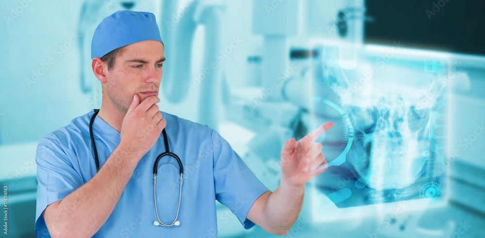 Composite image of surgeon pretending to be using futuristic Composite image of surgeon pretending to be using futuristic