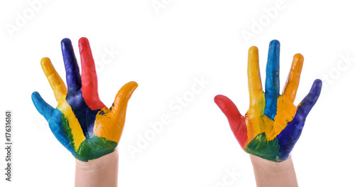 Hands of child in paint against white background