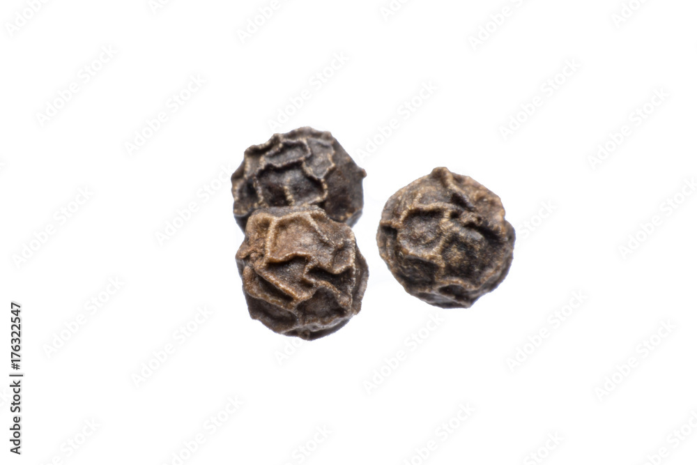 Black peppercorn against isolated on a white background Black peppercorn against isolated on a white background