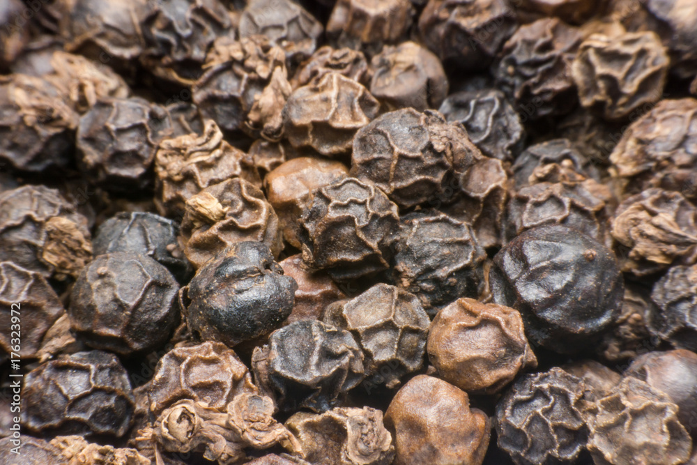 Black pepper grains as background close up Black pepper grains as background close up