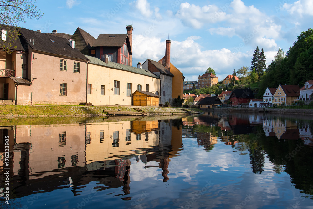 Cesky Krumlov in sunny day with reflection in the water Cesky Krumlov in sunny day with reflection in the water