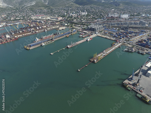 Industrial seaport, top view. Port cranes and cargo ships and ba © eleonimages