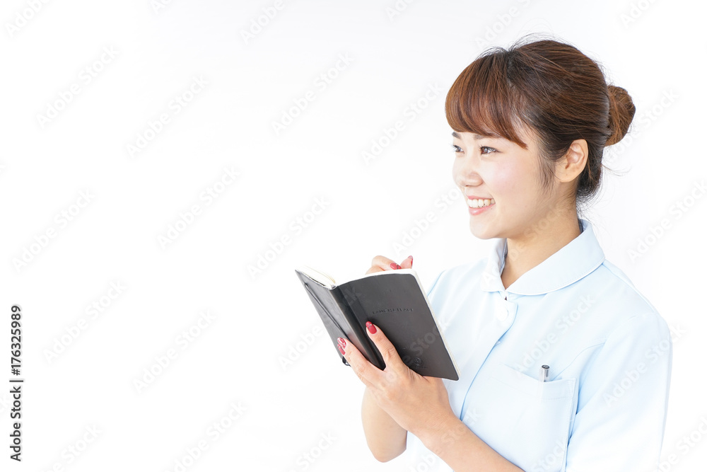 Nurse taking a memo Nurse taking a memo