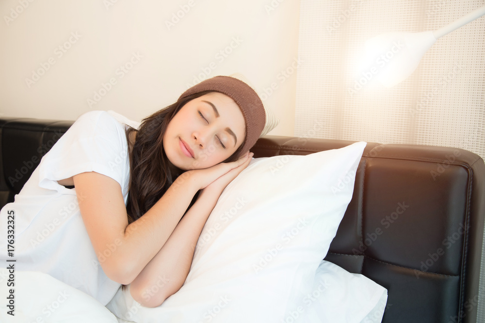 woman in white shirt sleeping on her bedroom. concept for healthy. woman in white shirt sleeping on her bedroom. concept for healthy.