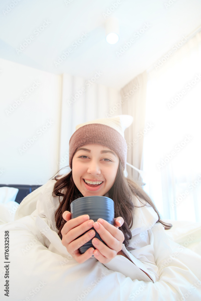 Portrait of a beautiful young lady drinking her morning coffee in her bedroom Portrait of a beautiful young lady drinking her morning coffee in her bedroom