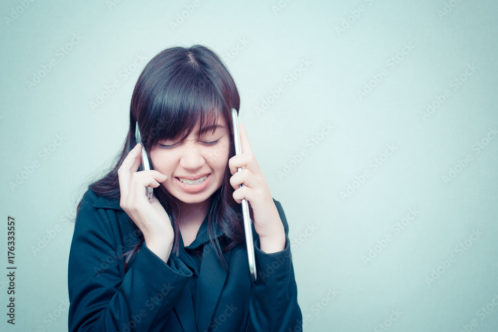 businesswoman multi tasking busy with phone tablet. concept for business businesswoman multi tasking busy with phone tablet. concept for business