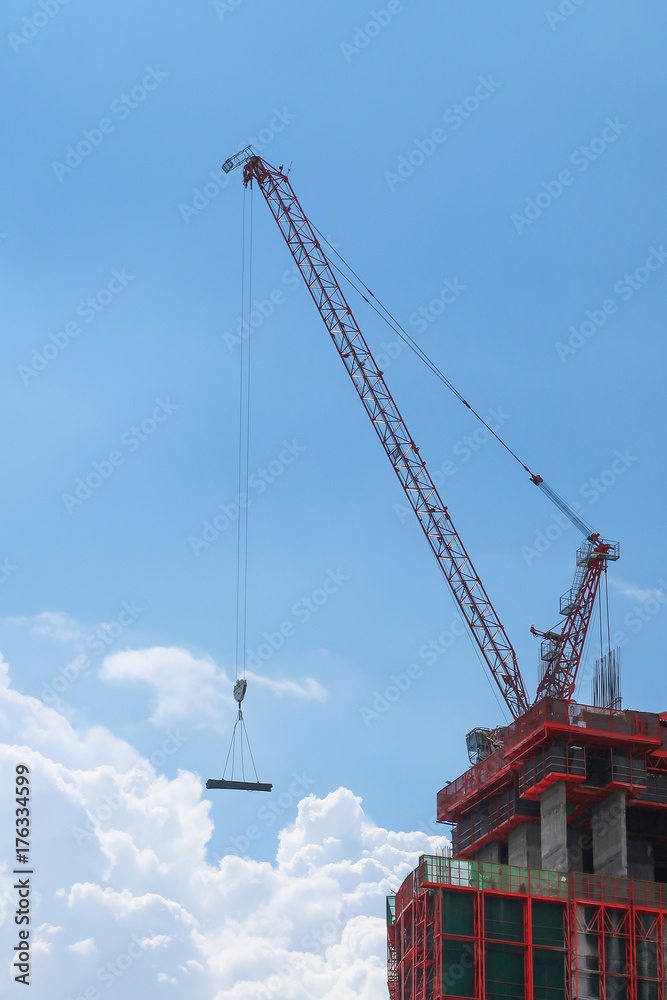 Building construction with crane on cloudy day Building construction with crane on cloudy day